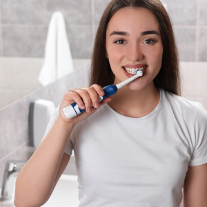 Lady brushing her teeth