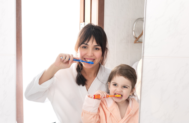 family brushing teeth
