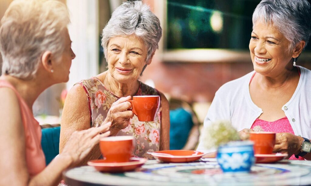 Elderly ladies having tea