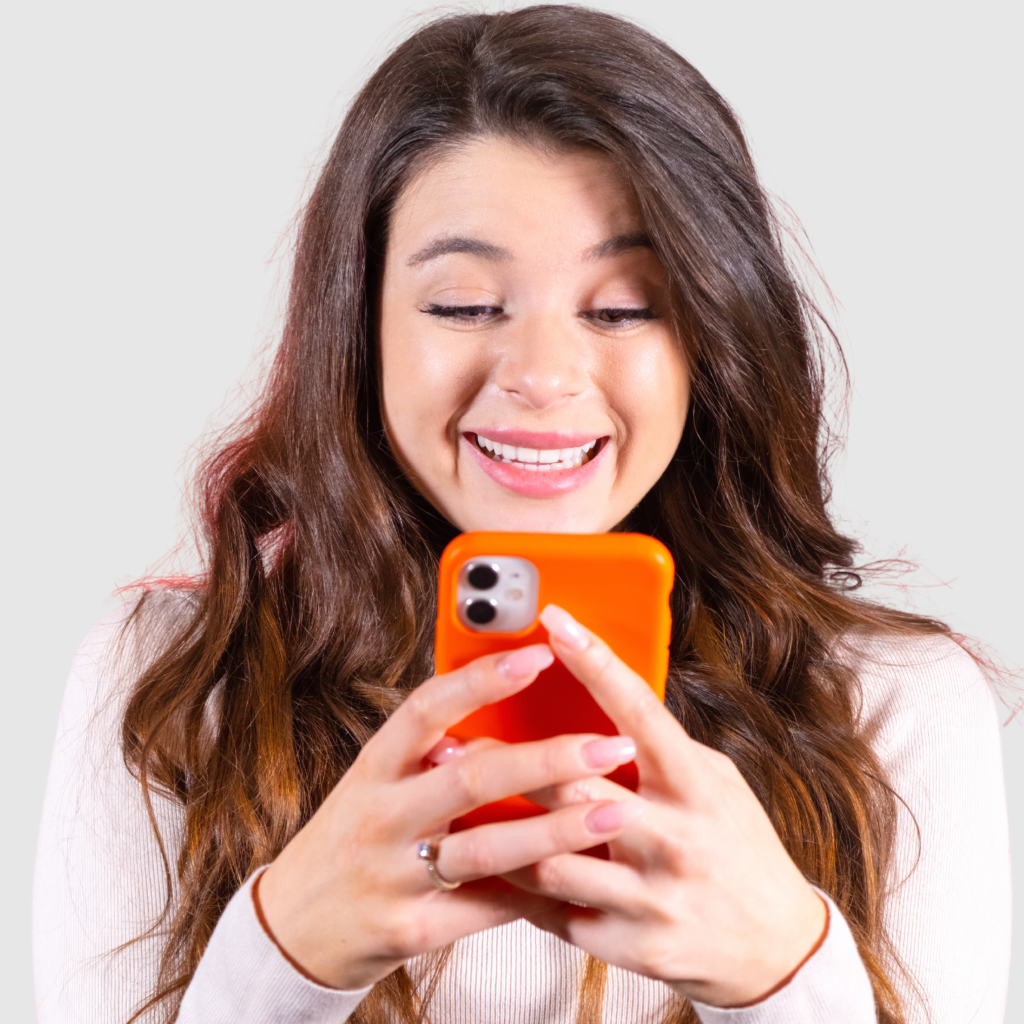 lady smiling into her mobile phone